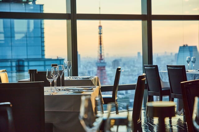 Private dining room at Fish Bank TOKYO with sunset skyline view for corporate gala or board dinner.