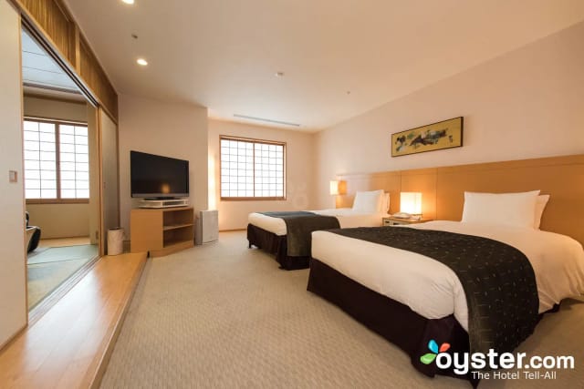 Sumire twin guest room at Ginza Creston, minimalist Japanese design for conference accommodations.