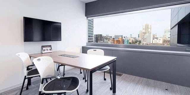 Coworking boardroom at Meguro Arco Tower with floor-to-ceiling windows for event meetings.