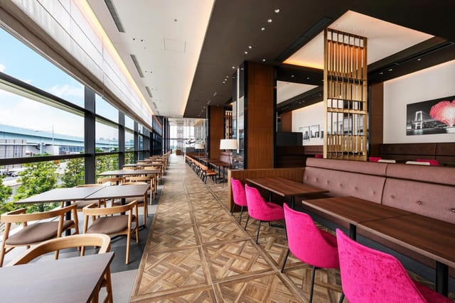 Modern hotel event space in Tokyo with floor-to-ceiling windows for meetings and conferences.