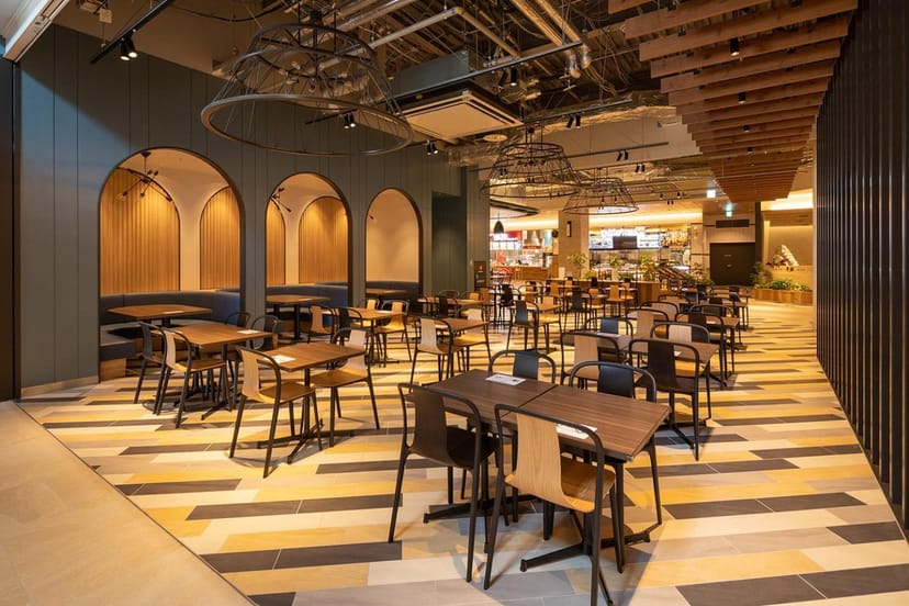 Modern restaurant breakout space with modular seating for corporate events and networking.