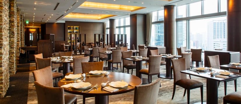 Upscale corporate luncheon venue at InterContinental Tokyo with panoramic city views for VIP events.