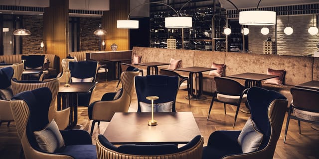 Upscale lounge seating at The Score Dining Experience, Tokyo, ideal for VIP networking events.