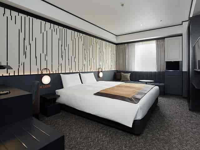 Premium hotel guest room with workspace for corporate travel and conference incentive bookings.