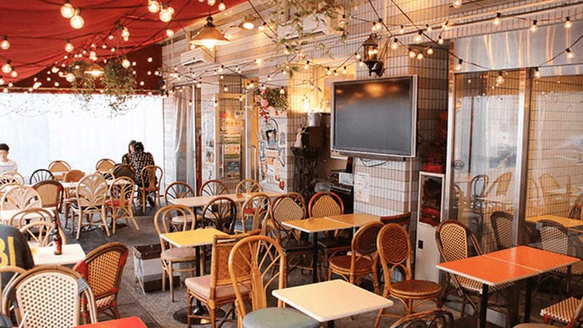 Networking mixer setup with bistro seating and string lighting at Hotel Metropolitan Ikebukuro.