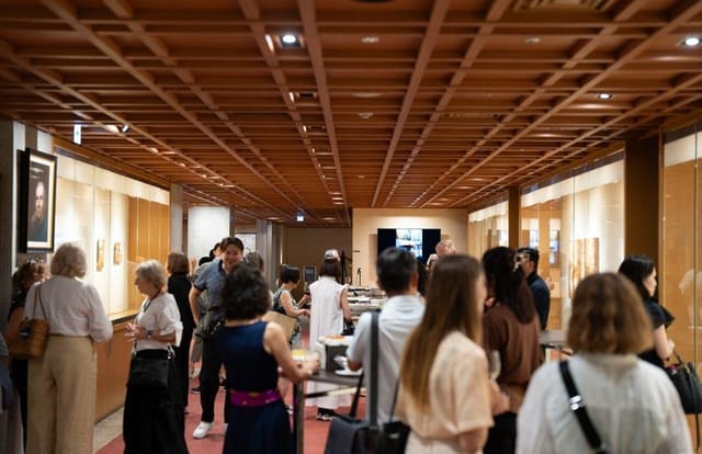 Networking reception at Tokyo American Club with sophisticated gallery-style event layout.