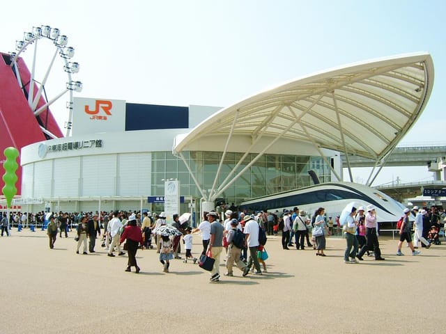 Conference Tower with dramatic canopy architecture at Tourism EXPO Japan event venue.