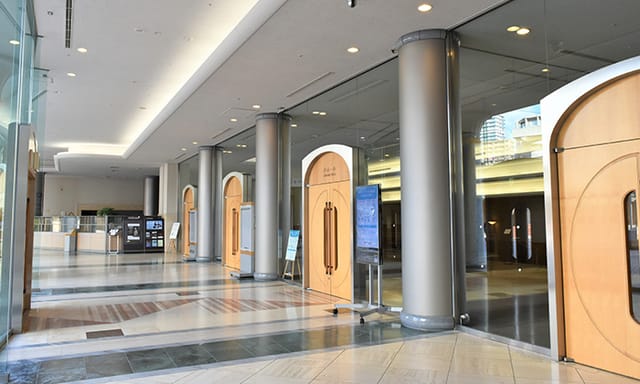 ACT CITY convention center foyer with modular signage for registration and business events.