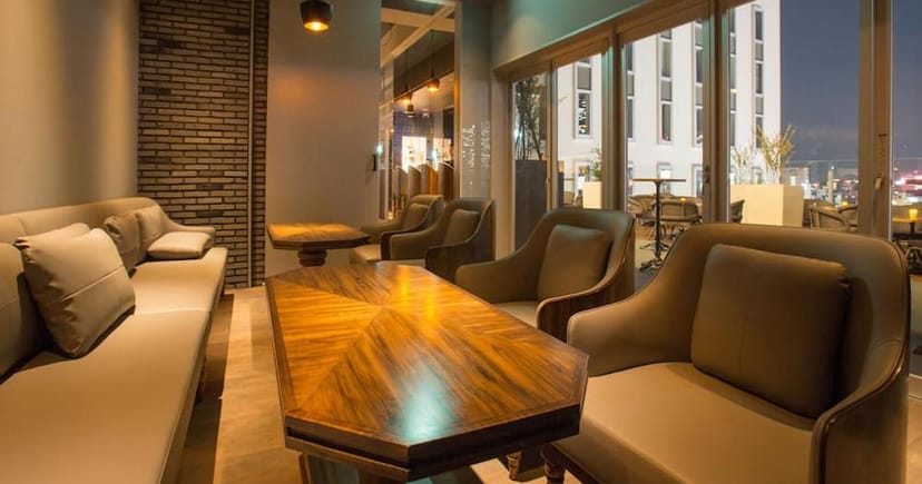 VIP lounge at Live cafe G, Shinjuku: stylish seating, outdoor terrace for networking events.