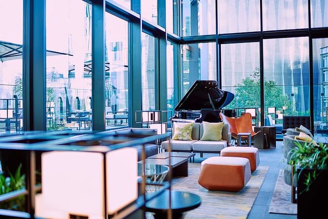 Luxury lounge with grand piano for VIP networking and cocktail events.
