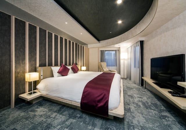 Luxury Daiwa Roynet Hotel Ginza suite with minimalist bed for executive and VIP event bookings.