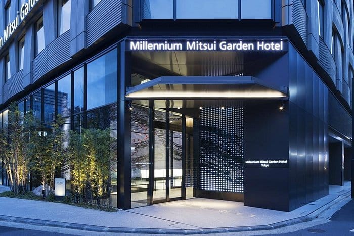 Modern hotel entrance, Millennium Mitsui Garden Tokyo, corporate event venue, business meeting space.