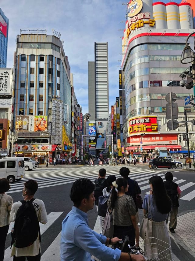 Event ceremony in Shinjuku, Tokyo, featuring dense crowd logistics and wayfinding.