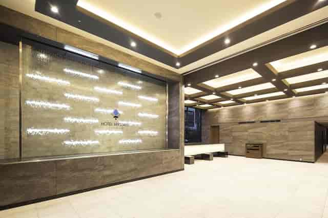 Modern hotel lobby meeting room with water feature, ideal for brand activations and networking.