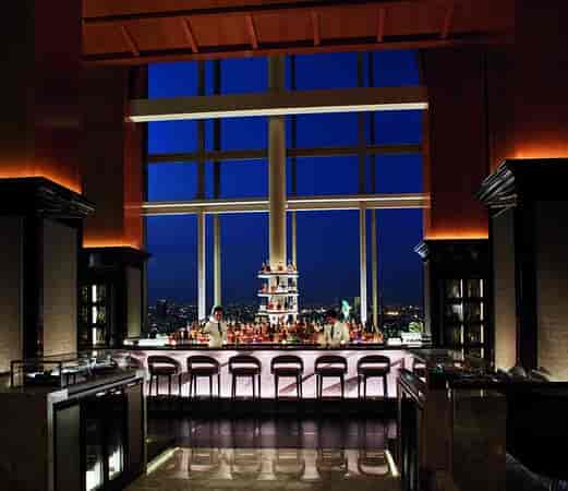 Lobby Bar with skyline view for upscale networking reception and executive cocktail hour.