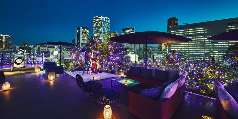Rooftop bistro venue with lounge seating for upscale corporate networking and cocktail events.