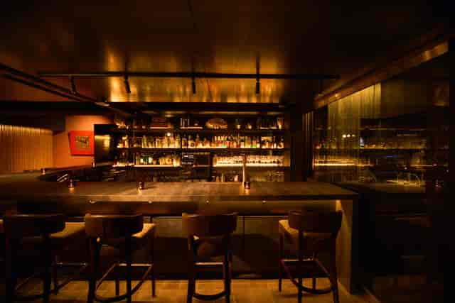 Moody hotel lounge for high-end corporate networking reception and professional event.