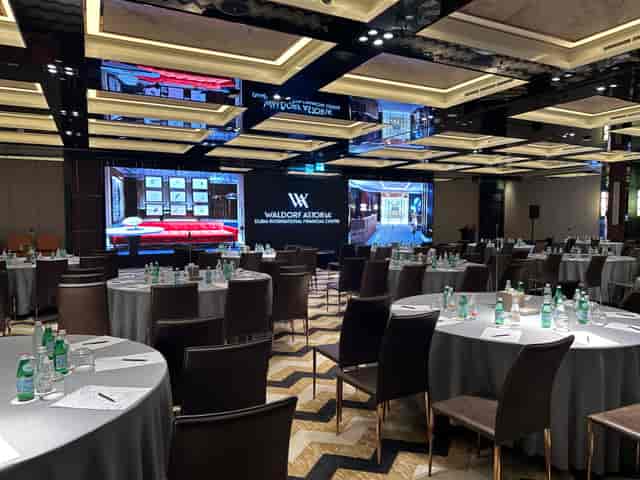 Waldorf Astoria DIFC ballroom with integrated LED branding for corporate gala dinners or conferences.