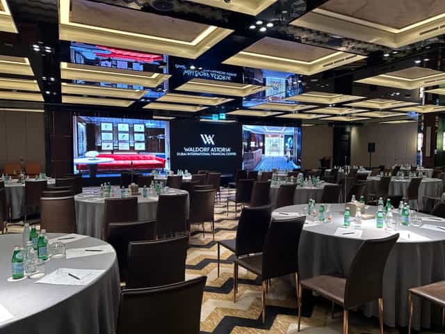 Waldorf Astoria DIFC ballroom with integrated LED branding for corporate gala dinners or conferences.