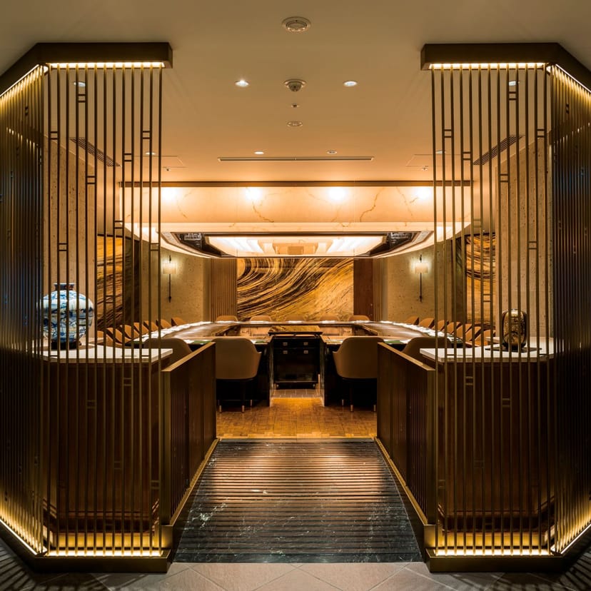 Private dining room for executive meetings and corporate events with sophisticated lighting.