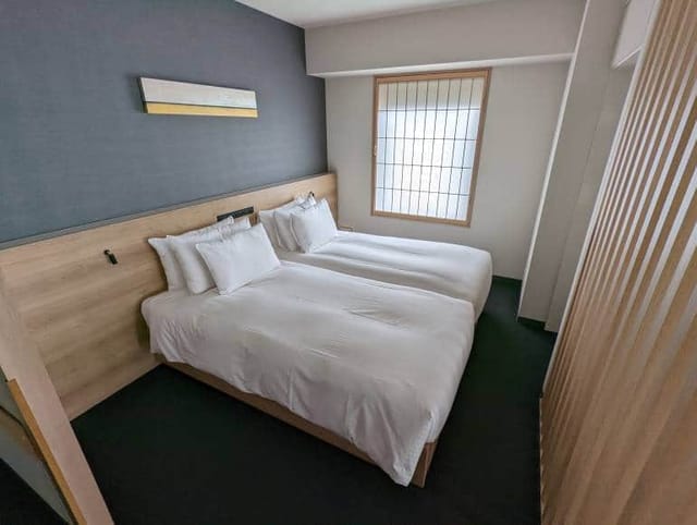Modern twin hotel room at MIMARU Tokyo Akasaka for business travel and conference lodging.