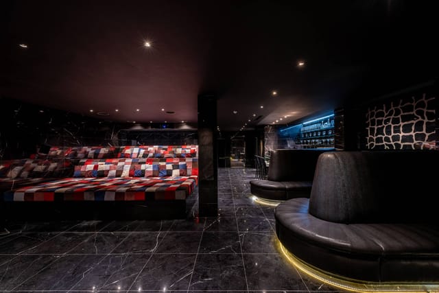 Luxe Cinema Bar VIP lounge for corporate networking and exclusive evening events.