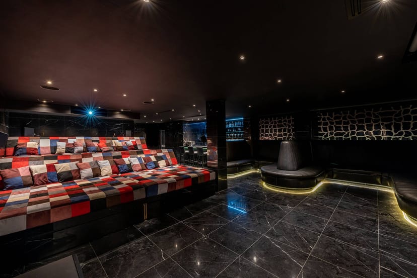 Intimate tiered Cinema Bar screening room for VIP film debuts and corporate event hire.
