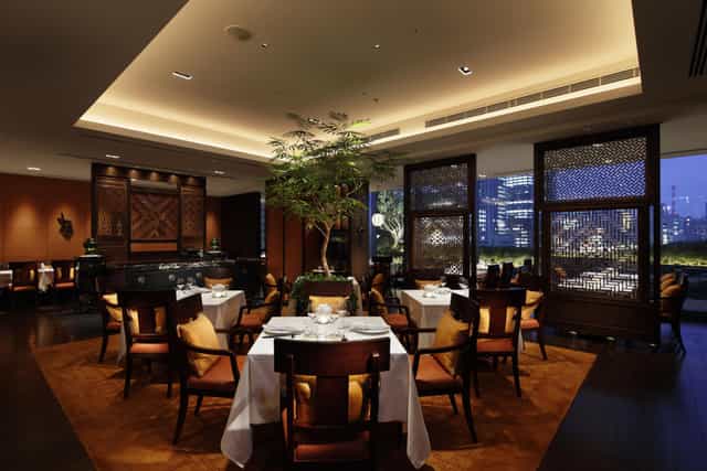 Esterre private dining room with city skyline view, ideal for luxury corporate and VIP events.