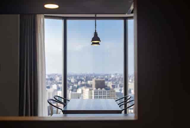 Executive boardroom at Hundred Stay Tokyo Shinjuku with skyline view for corporate meetings.