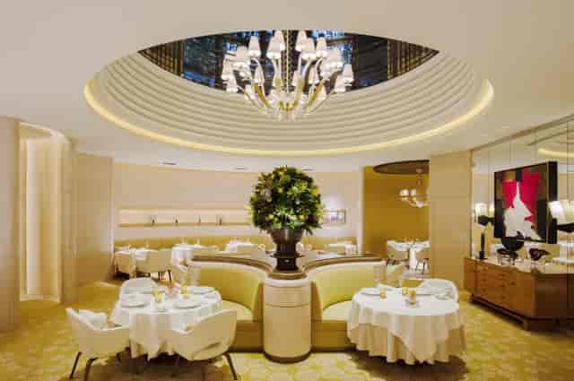 Private salon at L’OSIER with banquette seating for executive lunches and VIP board dinners.