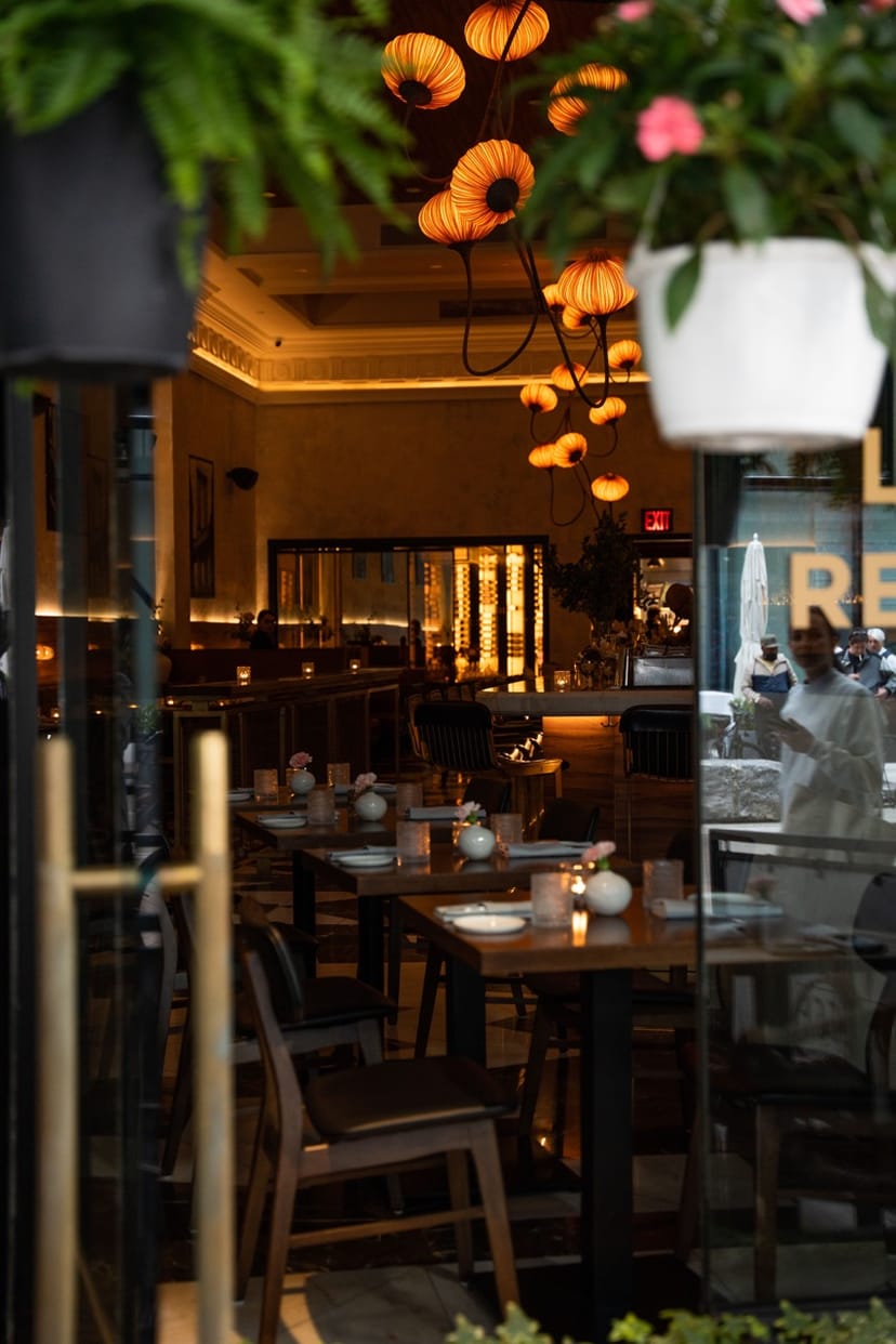 L'ADRESSE private dining room with dim lighting for corporate dinners and VIP networking events.