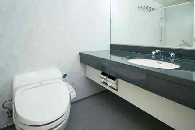 The OneFive Tokyo Kameido hotel bathroom with bidet toilet for event accommodation.