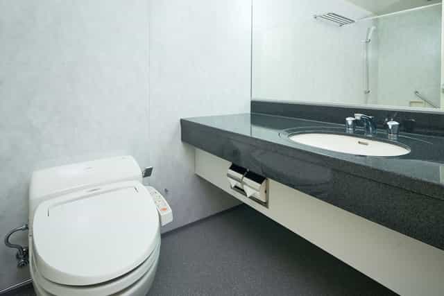 The OneFive Tokyo Kameido hotel bathroom with bidet toilet for event accommodation.