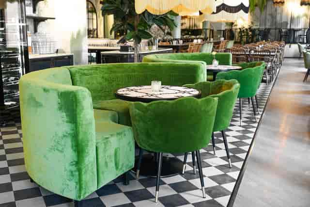 Plush velvet banquettes in Ravintola Kiila for intimate corporate events and VIP networking.