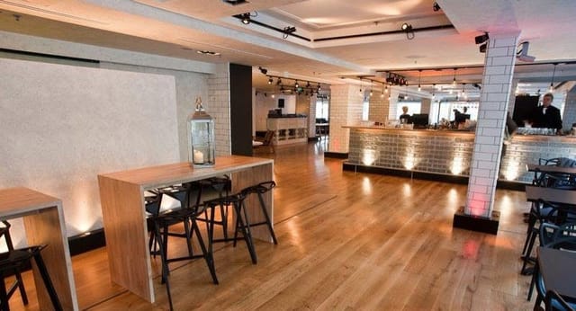 Modern industrial bar at Ravintola Kiila for networking events and corporate drinks.