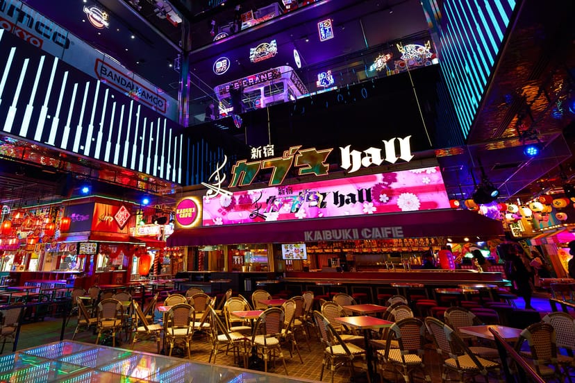 Main Stage at SPACE Shinjuku: Neon corporate event venue with vertical architecture.