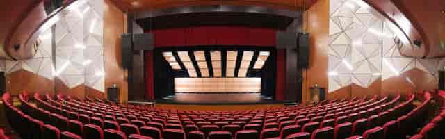 Proscenium auditorium at Ciputra Artpreneur with acoustic panels for corporate events and keynotes.