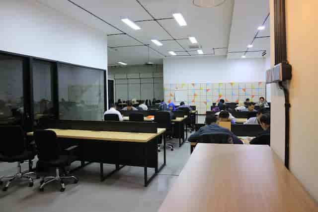Co-working space at BLOCK71 Indonesia with long-table desks for productive study and office work.