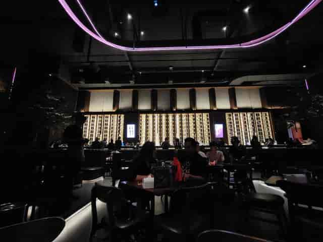 Elegant Holywings bar with architectural lighting for corporate networking and evening receptions.
