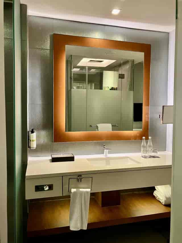 Modern hotel meeting room with premium bottled water for corporate events and VIP room blocks.