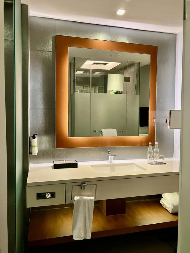 Modern hotel meeting room with premium bottled water for corporate events and VIP room blocks.