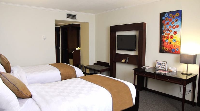 Double-queen hotel meeting room for corporate events and business travel.
