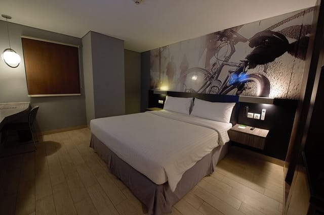 Modern hotel function room with local-themed accent wall for business meetings and events.