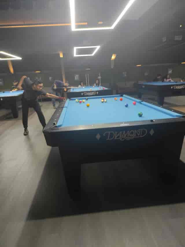 Team building breakout session at Mantra Space featuring professional office billiards tables.