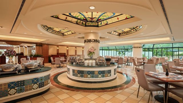 Sari Pacific Jakarta Grand Ballroom buffet with stained-glass for upscale corporate event dining.