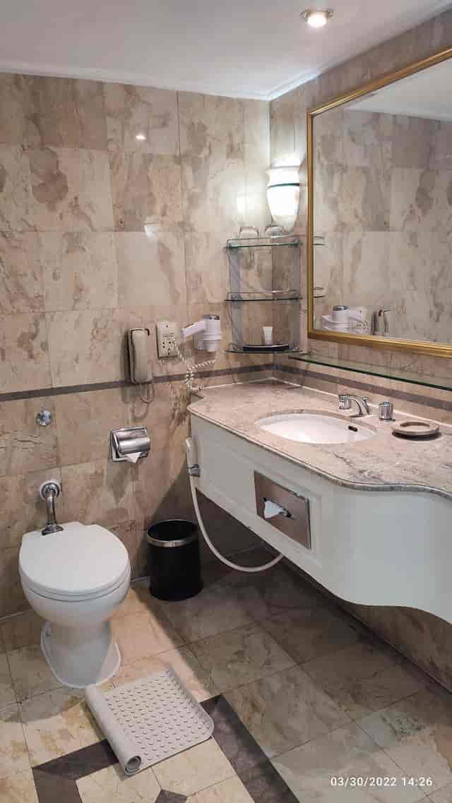 Dated bathroom in Sari Pacific Jakarta, Istana Room, hotel renovation project.