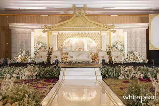 Grand Ballroom wedding stage with floral decor at JS Luwansa Hotel Jakarta, luxury event venue.