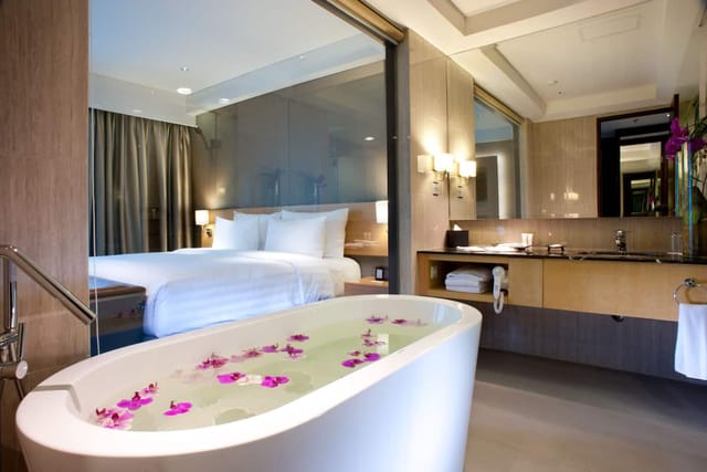 Luxury JS Luwansa Hotel Jakarta guest room with soaking tub for VIP corporate incentive events.