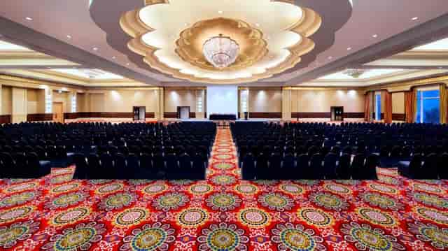 Ritz-Carlton Jakarta ballroom theater setup with architectural ceiling for large conferences.