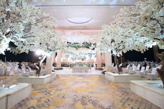 Luxury ballroom with floral installations for high-end weddings and formal gala events.